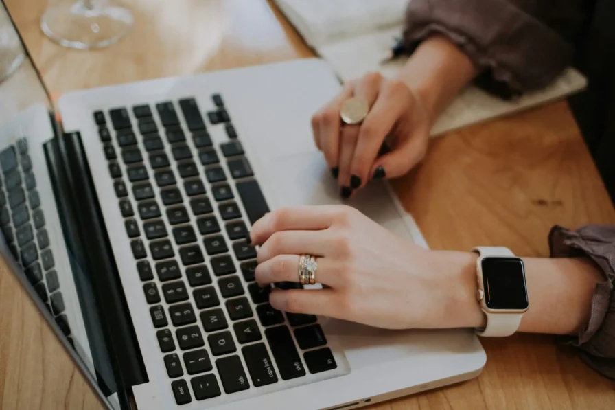 close up of a self-employed person using a laptop